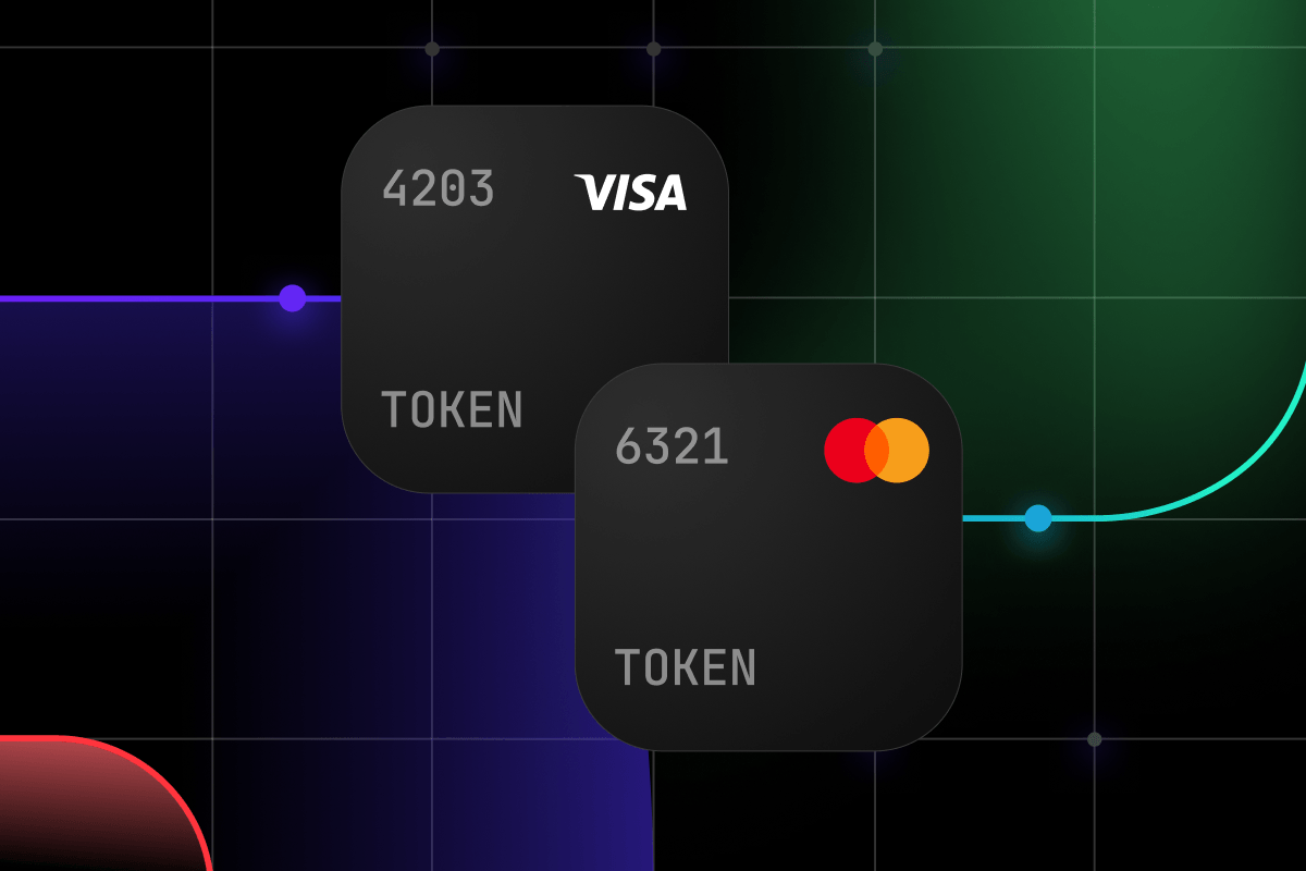 Two dark payment cards, Visa and Mastercard, displaying partial numbers and 'TOKEN' text.