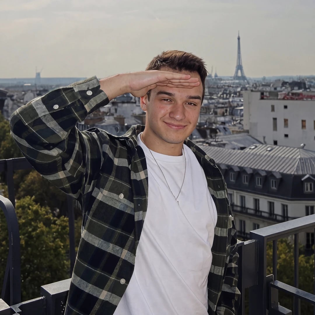 Vlad saluting with the Eiffel Tower in the background
