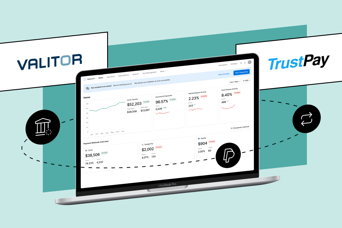 A laptop displays a payment dashboard, with Valitor and TrustPay logos and icons for banking, payout, and transaction analytics.