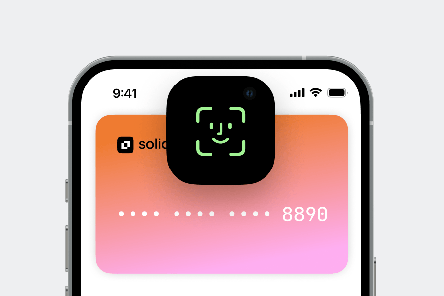 Smartphone displaying a digital card on screen with a Face ID authentication icon shown above the card.